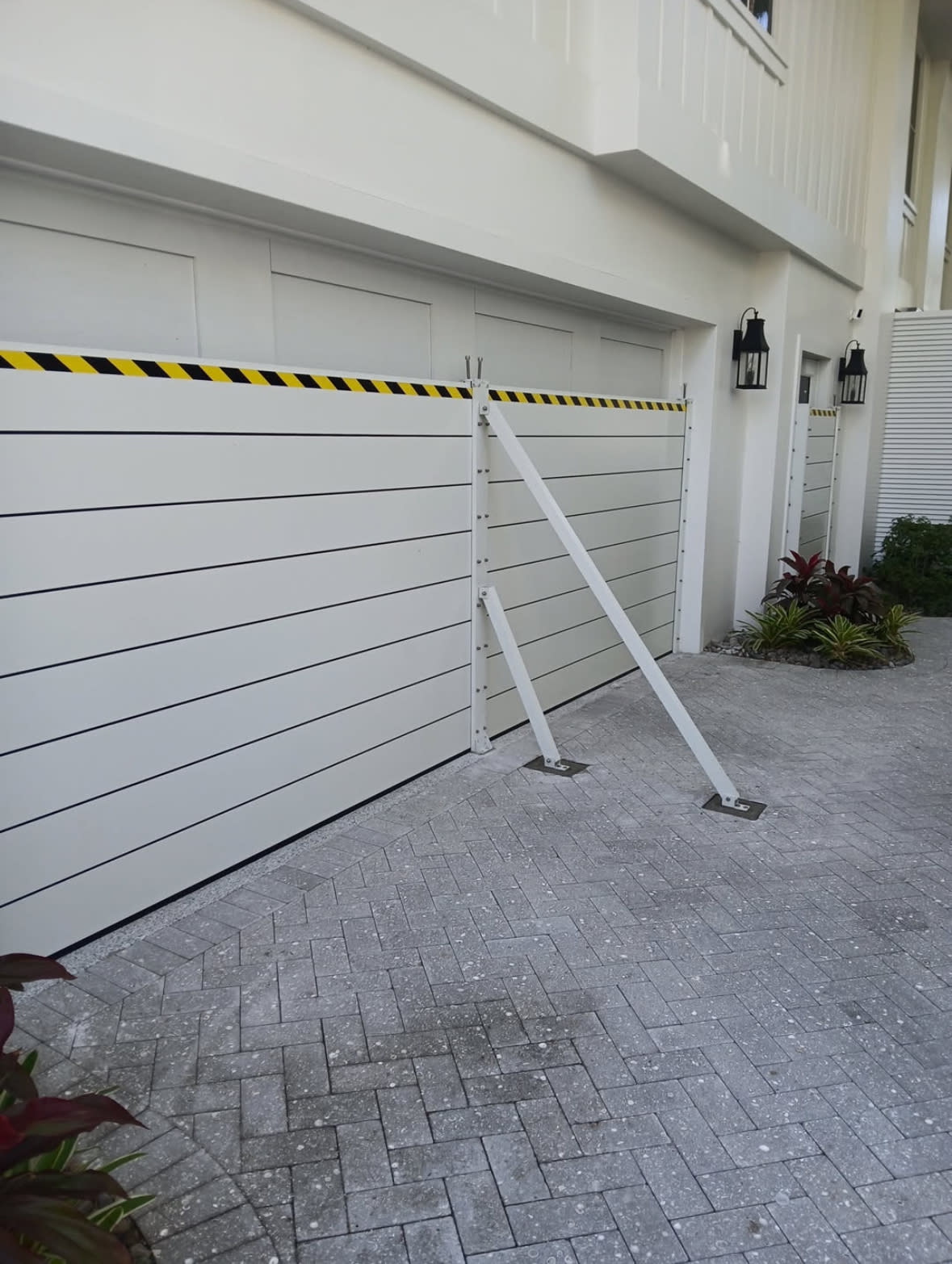 Installed flood barrier system on a North Naples waterfront residence
