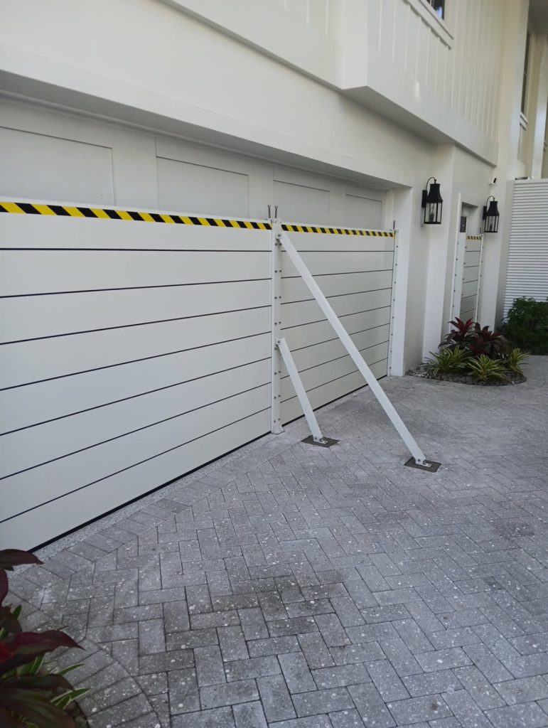 Aluminum plank flood barrier installation